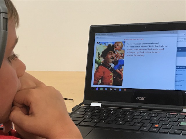 WPS student looking at music on computer