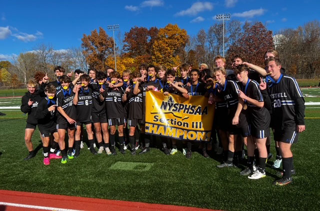 Westhill boys soccer team with Section 3 championship banner